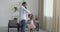 Loving afro american dad holding hand of his daughter dancing with cute little child princess wears pink dress in modern