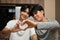 A loving asian teenage gay men couple making heart shape with hands. LGBT