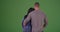 Loving black couple looking out to the distance on green screen