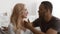 Loving Black Husband Touching Wife\'s Chin Flirting Sitting At Home