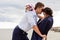 Loving bride and groom standing on the pier.