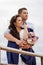 Loving bride and groom standing on the pier.