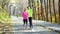 Loving couple of athletes posing for selfie photo in autumn park