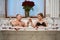 Loving couple basks in bath with rose petals and champagne