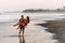 Loving couple on the beach having fun. Honeymoon of newlyweds. Couple travels. Holiday in GOA. Lovers on the island.