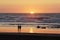 Loving couple in the beach watching sunset