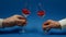 Loving couple clink glasses  close up hands view. Red hearts in glass instead wine