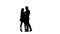 Loving couple is dancing Latin dances in the studio. Silhouette. White background. Slow motion