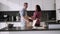 Loving couple dancing romantic dance on date in kitchen