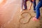 A loving couple draws a heart on the sand on the beach