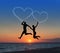 Loving couple flying it sky against sea beachand heart-shaped
