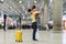 Loving couple happy meeting after long time. African man and woman excited hug in airport terminal