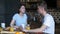 Loving couple having breakfast in modern kitchen