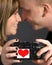 Loving couple holding camera