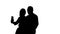 Loving couple makes selfie. Silhouette. White background. Slow motion. Close up