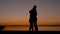 Loving Couple Men And Women Kissing And Cuddling At Sunset On The Beach