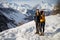 A loving couple plays together in the snow outdoors. Winter holidays in the mountains.