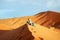 Loving couple in the Sahara Desert