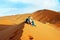 Loving couple in the Sahara Desert. Morocco