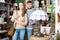 Loving couple in shop of secondhand furniture