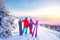 Loving couple snowboarder and skier hold hands on a background of mountains in the winter forest, Sunlight. Concept ski