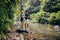 Loving couple standing by a mountain stream