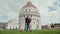 Loving couple takes self photo by smart phone against background of Baptistery of St. John, Pisa, Italy. Travel concept