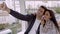 Loving couple taking a selfie in a ferris wheel