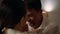 Loving couple touching foreheads at evening room closeup. Lovers romantic date