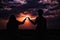 A loving couple uses the sunset to create a romantic scene