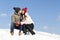 Loving couple in winter hats kissing against the blue sky. Trust and tenderness. Winter date