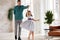 Loving dad dancing swaying smiling preschooler daughter