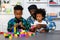 Loving Father Teaches and Plays with Son at Home for Learning and Education on Counting Cube in Math and Skill Development. Father