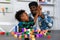 Loving Father Teaches and Plays with Son at Home for Learning and Education on Counting Cube in Math and Skill Development. Father