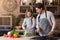 Loving father teaching little girl how to cook healthy food