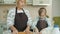 Loving grandmother cooking with child touching her nose with flour-covered finger laughing