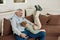 Loving grandpa. Portrait of a happy grandfather and excited grandson embracing, having fun and playing while relaxing on