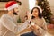 Loving husband feeding cookies to his wife