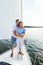 Loving Husband Hugging Wife Enjoying Romantic Yacht Tour Outdoors, Vertical