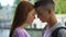 Loving male female teenagers touching foreheads, romantic feelings, tenderness