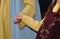 loving married couples holding hands in medieval clothes during  reenactment