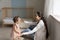 Loving mom watch toddler daughter make first steps