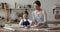 Loving mommy teach little daughter to cook