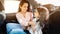 Loving mother and daughter share moment inside a car