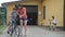 Loving mother help her cute son ride a bicycle