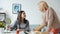 Loving mother helping teenage daughter with make-up applying cosmetics enjoying leisure time at home