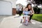 Loving Mother Teaching Son To Ride Tricycle