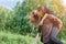 Loving multilingual couple on a walk in the Park. In love and very cheerful couple. Girl riding a guy.