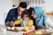 Loving Muslim Parents Teaching Cute Little Girl How To Cook