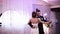 Loving newlywed couple dancing the first dance at wedding